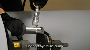 The hydraulic hoses of the dual pump are connected to the assemblies.